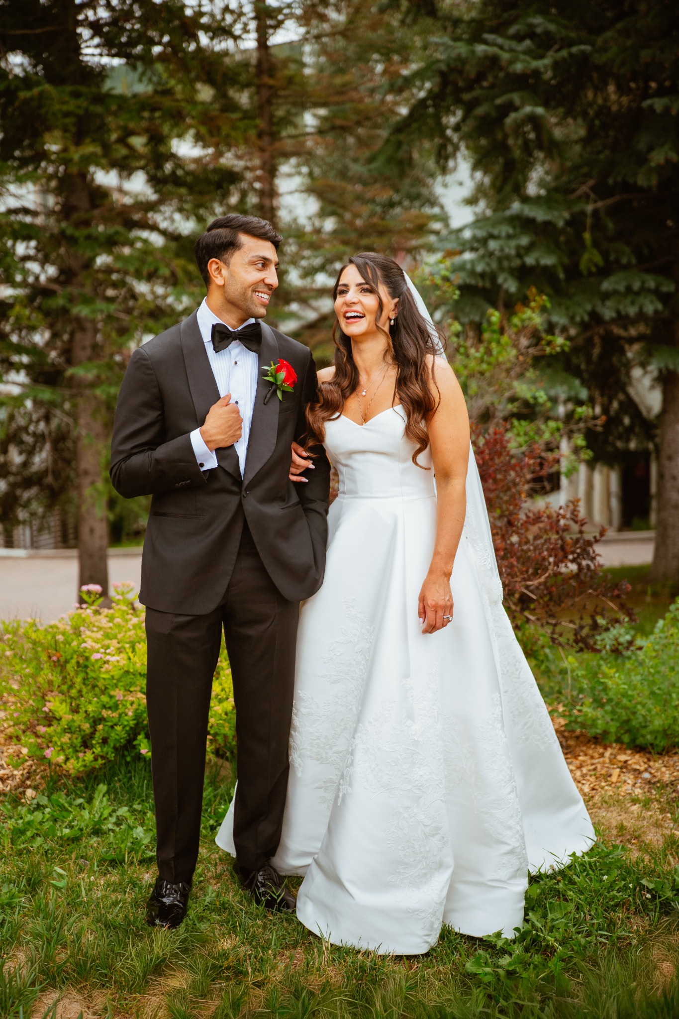 Tara and Jacob laughing together on their wedding day